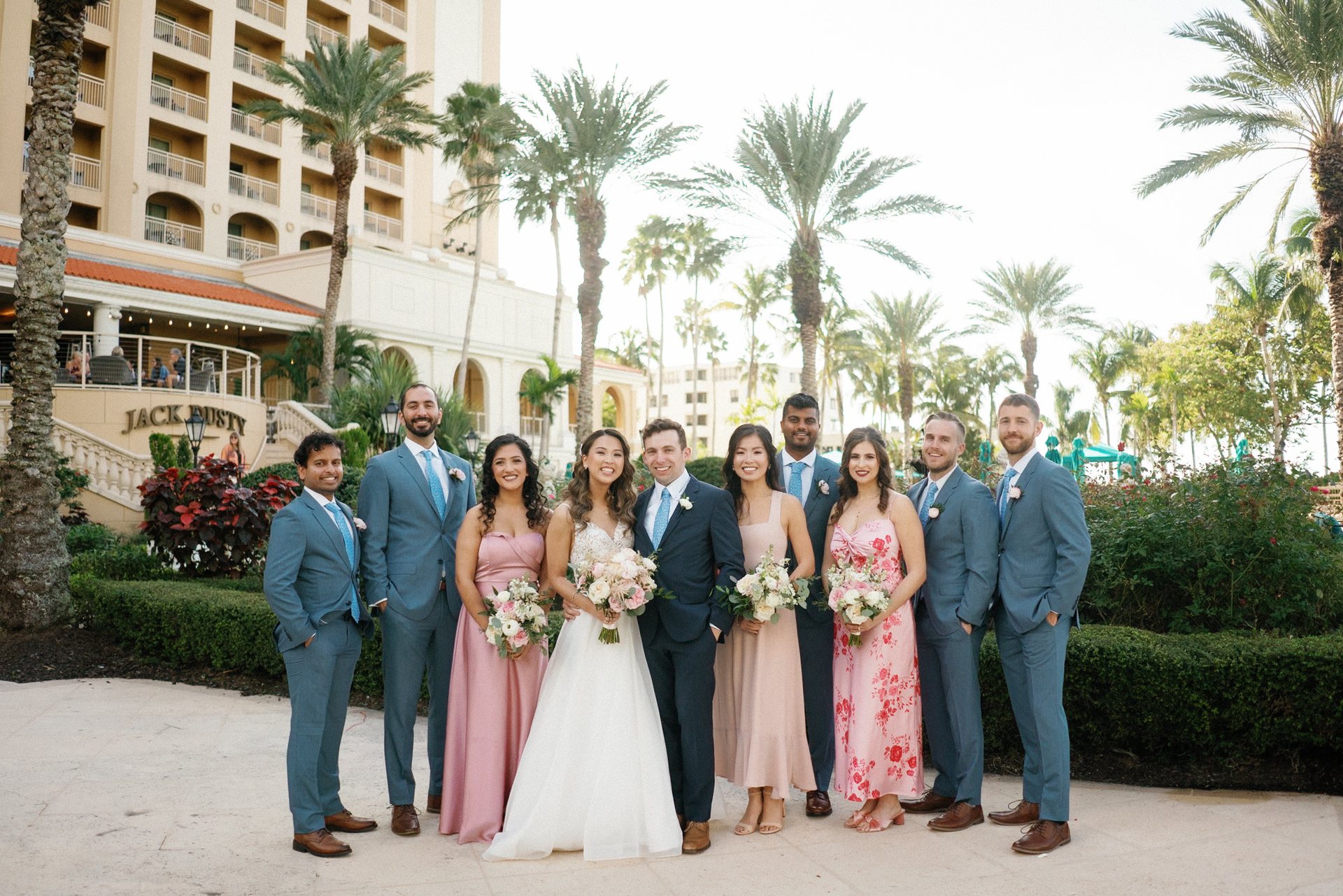Fine art wedding couple walking in sunlit garden, graded by InPix.Me